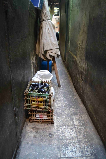 <a class="fancybox" rel="gallery-encroachments-and-territory-markers" href="https://www.cuipcairo.org/sites/default/files/styles/largest/public/dsc_0344_01.jpg?itok=kk8Nezyk" title="Vegetable baskets belonging to the restaurant overlooking al-Falaki Street obstruct smooth circulation and make the passageway even narrower.">Enlarge</a><br >Vegetable baskets belonging to the restaurant overlooking al-Falaki Street obstruct smooth circulation and make the passageway even narrower.